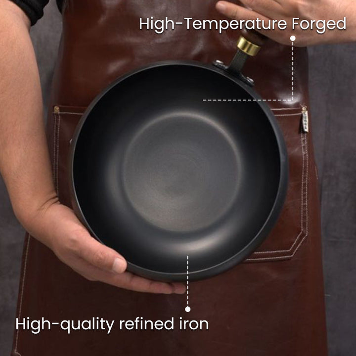 High-temperature forged cast iron pot held by a chef