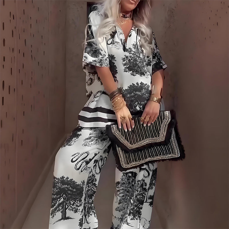Close-up view of the white printed V-neck top and matching trousers