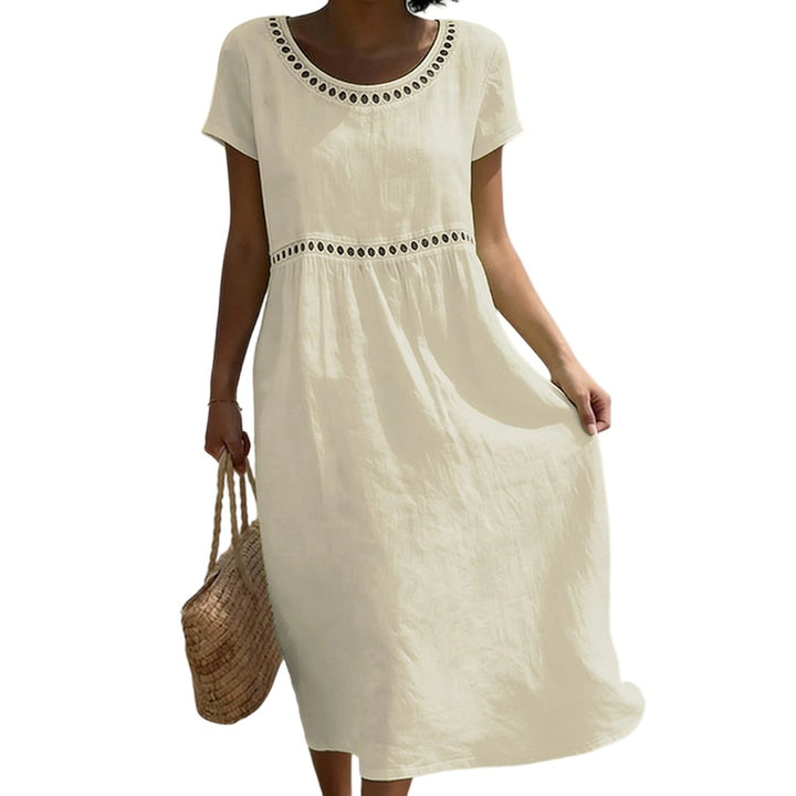 Close-up of hemline and stitching details on casual midi dress for women