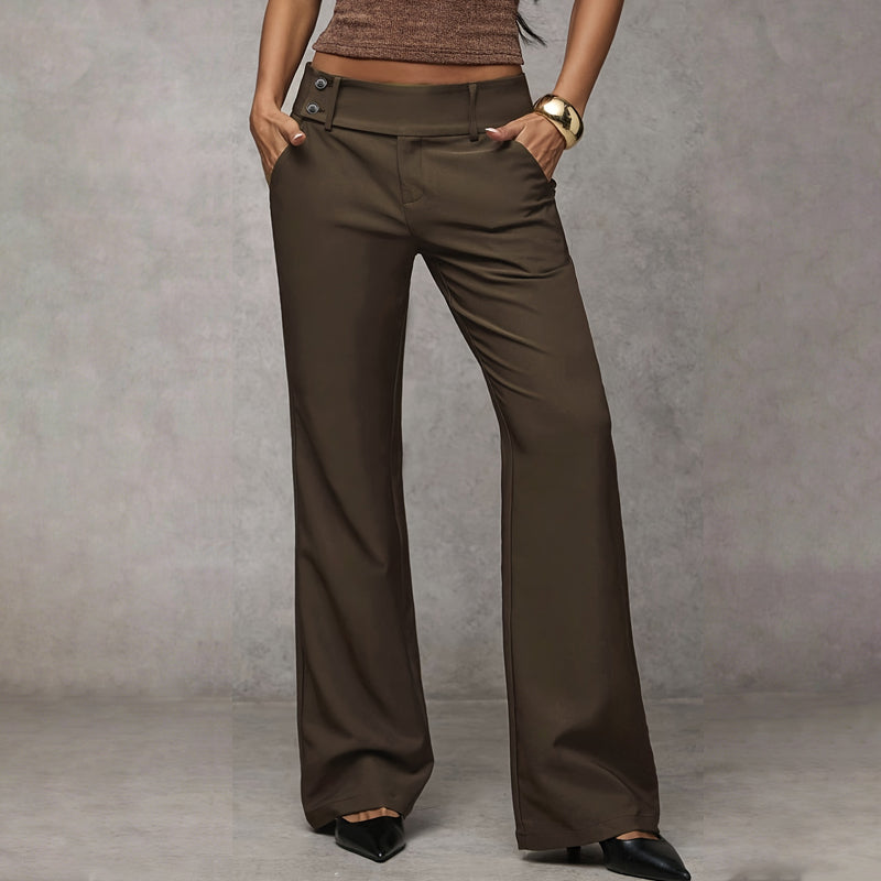 Model wearing brown flared trousers showcasing the wide-leg silhouette