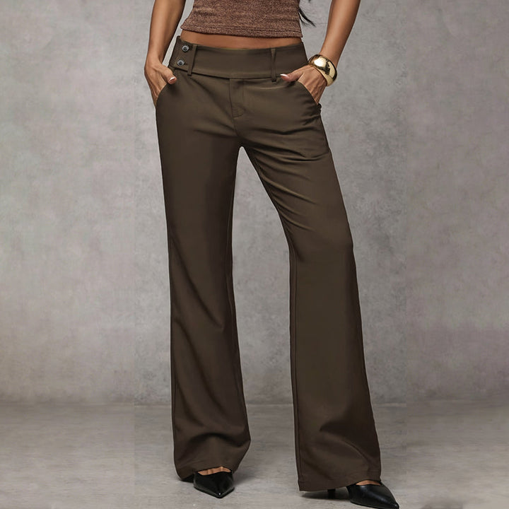Model wearing brown flared trousers showcasing the wide-leg silhouette