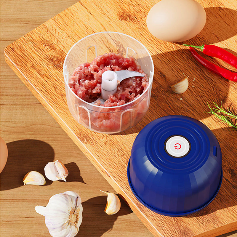 Wireless electric mini food chopper for kitchen on a clean white surface