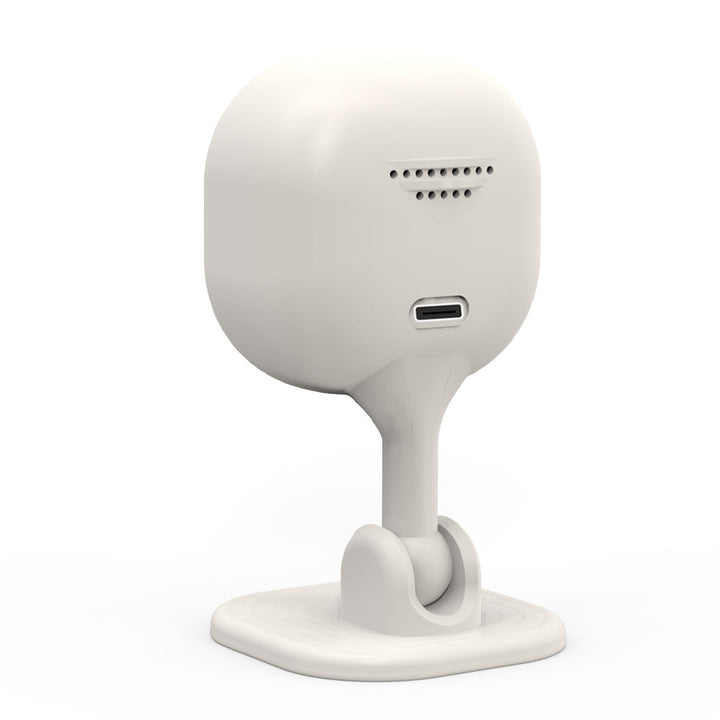 Wireless surveillance camera placed on a shelf monitoring a room interior