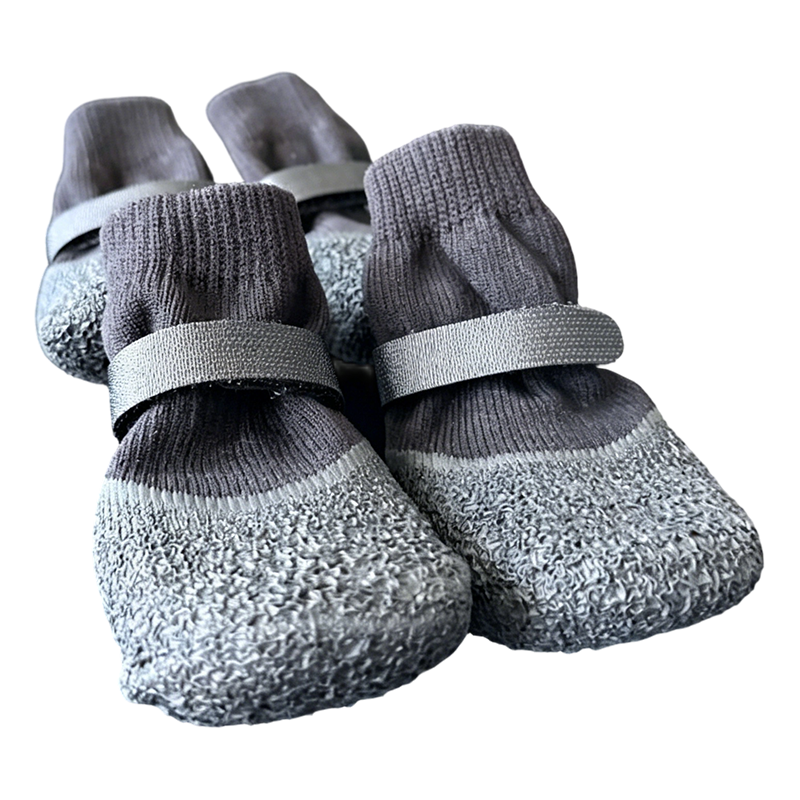 Flexible and soft fabric of waterproof dog socks shown bent to demonstrate comfort.