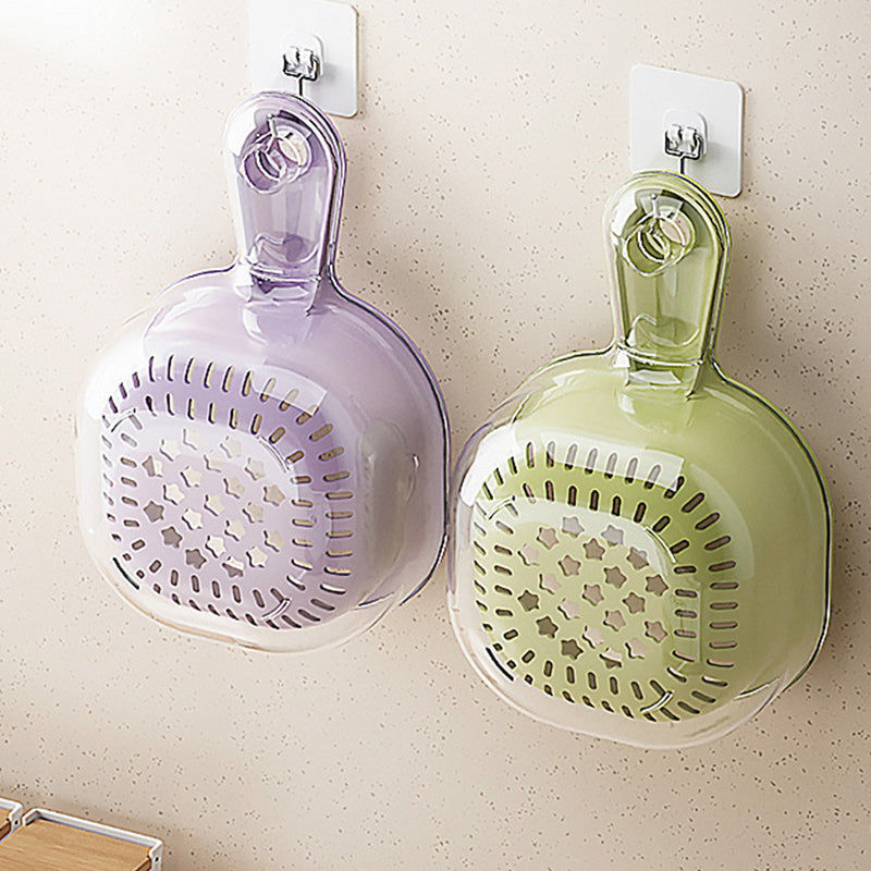 Green kitchen tool double layer strainer draining freshly washed vegetables