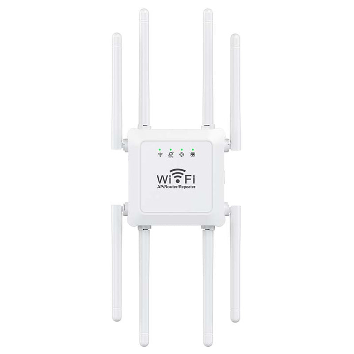 Wireless signal booster placed on a desk next to a laptop in a home office