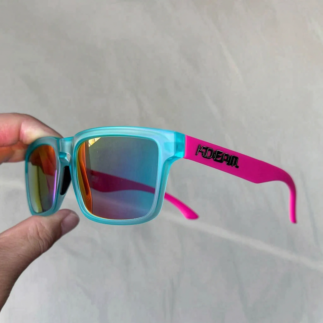 Light blue and pink square frame polarized sunglasses held by hand