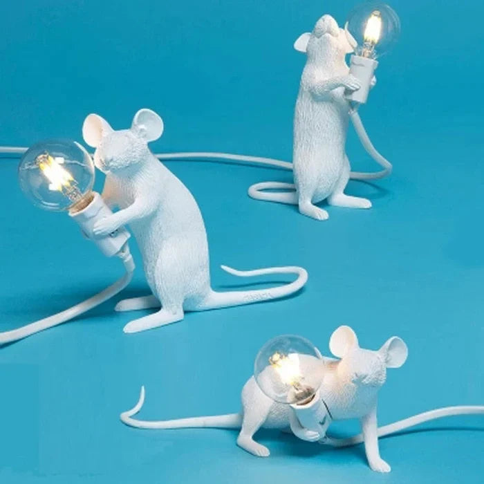 Stylized mouse figurine desk light illuminating stylish home interior