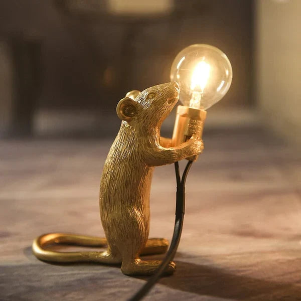 Artistic golden mouse light sculpture serving as functional accent piece
