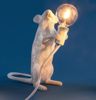 Adorable rodent shaped interior design lamp on a wooden nightstand