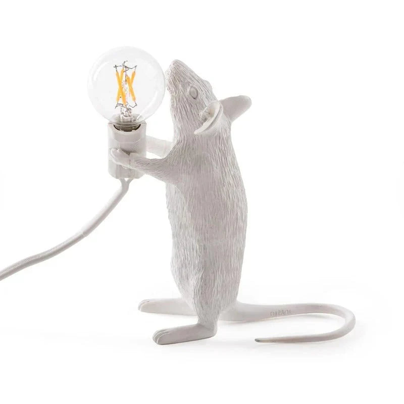 Standing white mouse table lamp holding a bulb