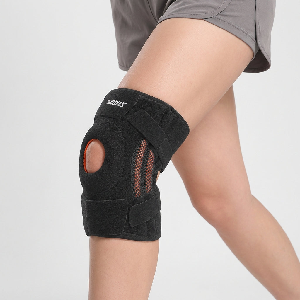 Person wearing black open patella knee brace during physical activity