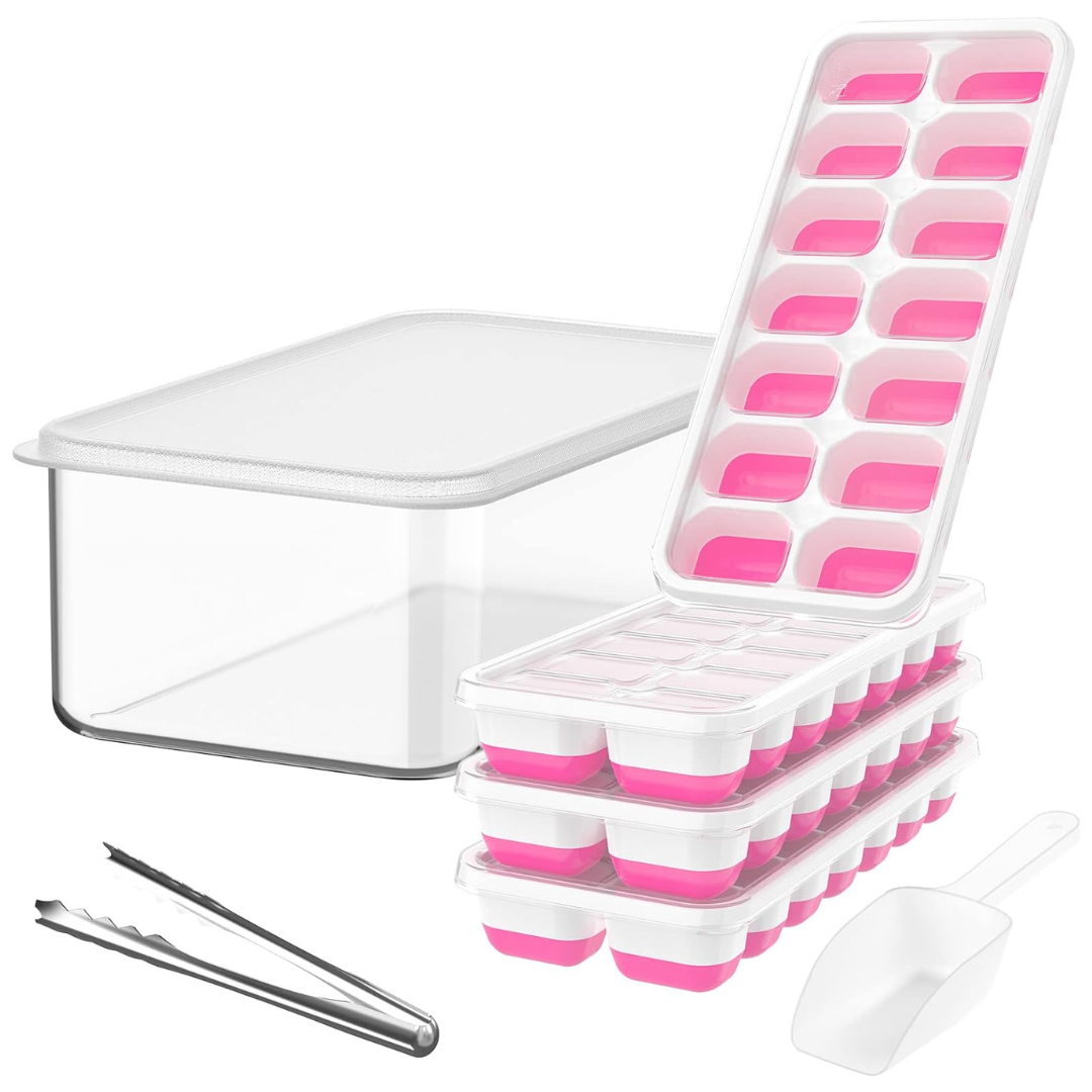 Silicone ice cube tray releasing cubes into the clear storage bin