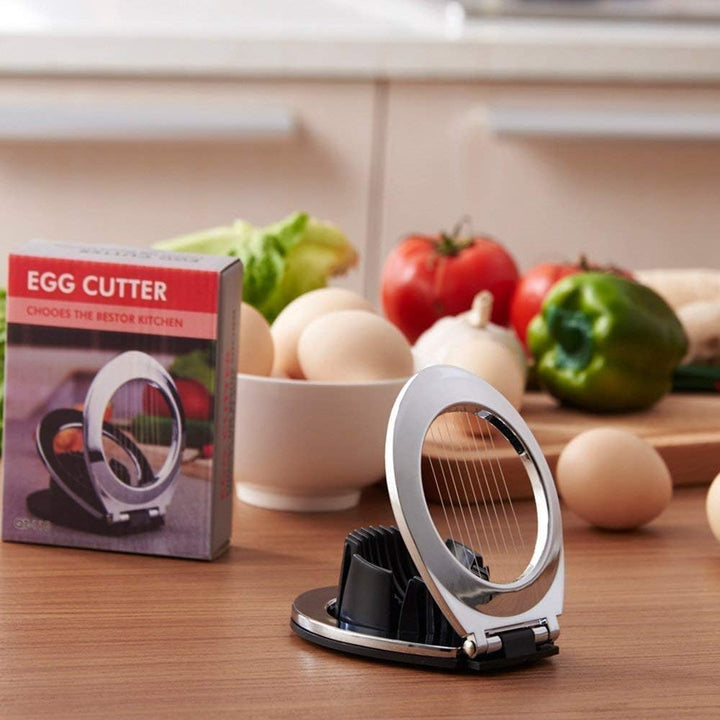 Ergonomic design of the stainless steel egg slicer kitchen gadget in use