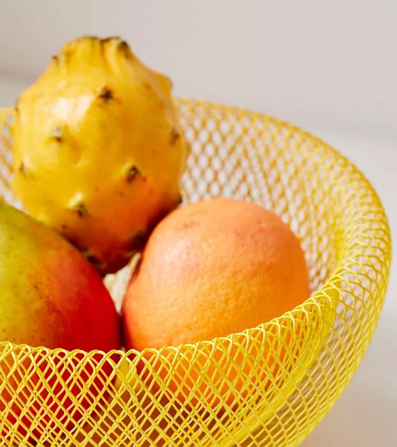 Modern steel mesh fruit basket showcasing countertop storage capacity