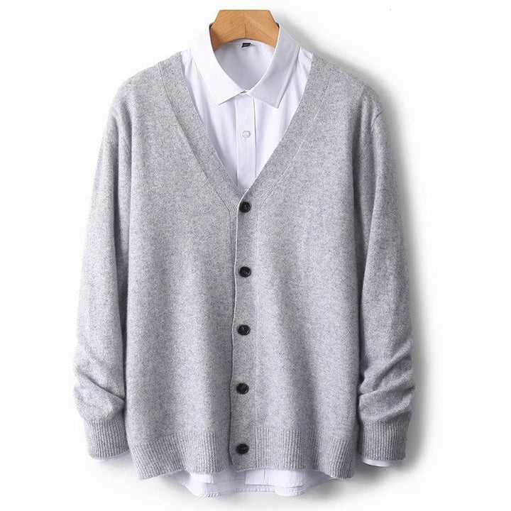 Close-up view of ribbed cuffs and button placket on a men's knit cardigan