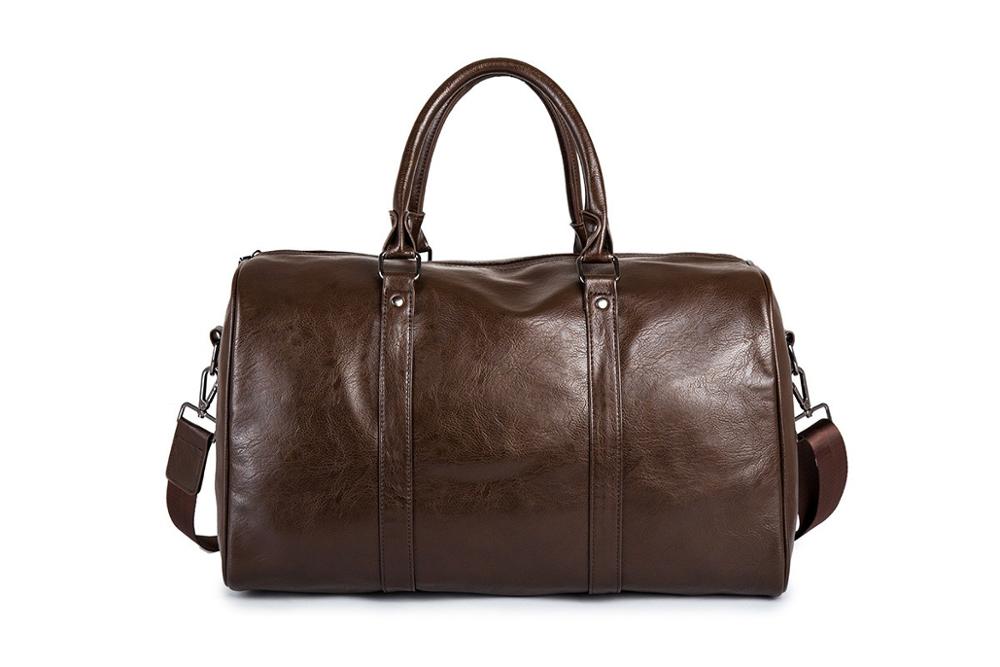 Side view of lightweight leather duffel bag with adjustable shoulder strap
