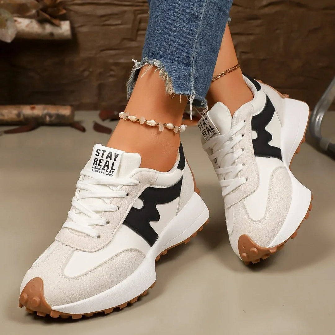 Close-up of color block sneakers for women highlighting patterned stripes and texture