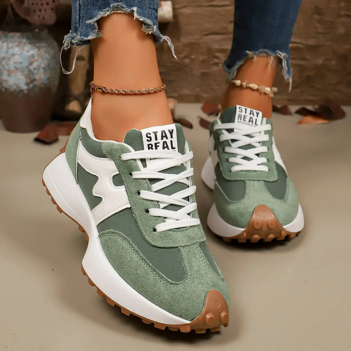 Top-down view of casual walking shoes for women featuring lace-up closure and striped pattern