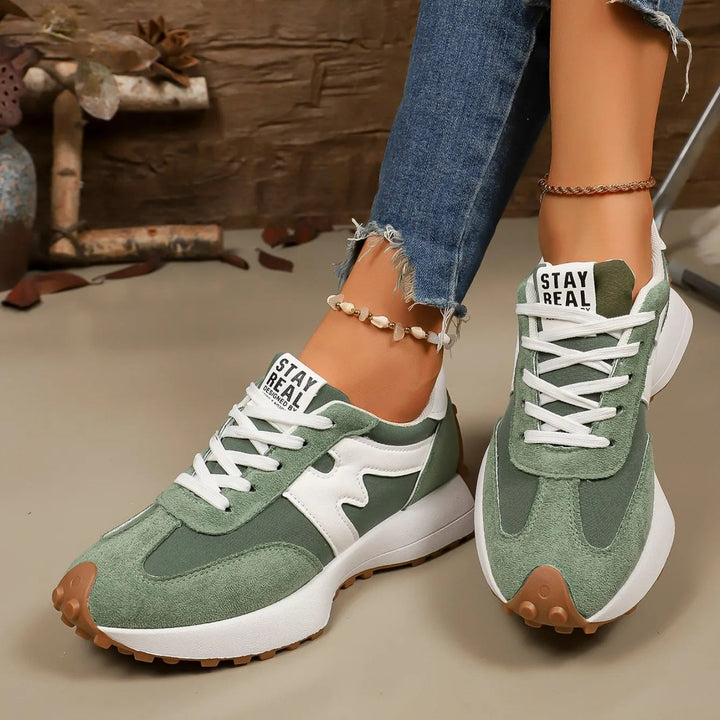 Angle shot of trendy women's shoes showcasing platform sole and stylish striped exterior