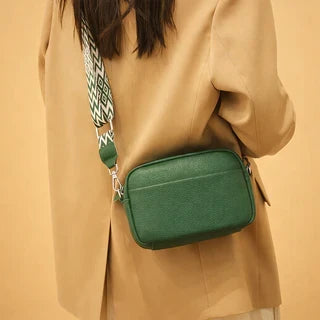 Compact everyday purse worn by model for scale