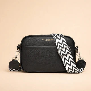 Black minimalist crossbody bag with patterned strap