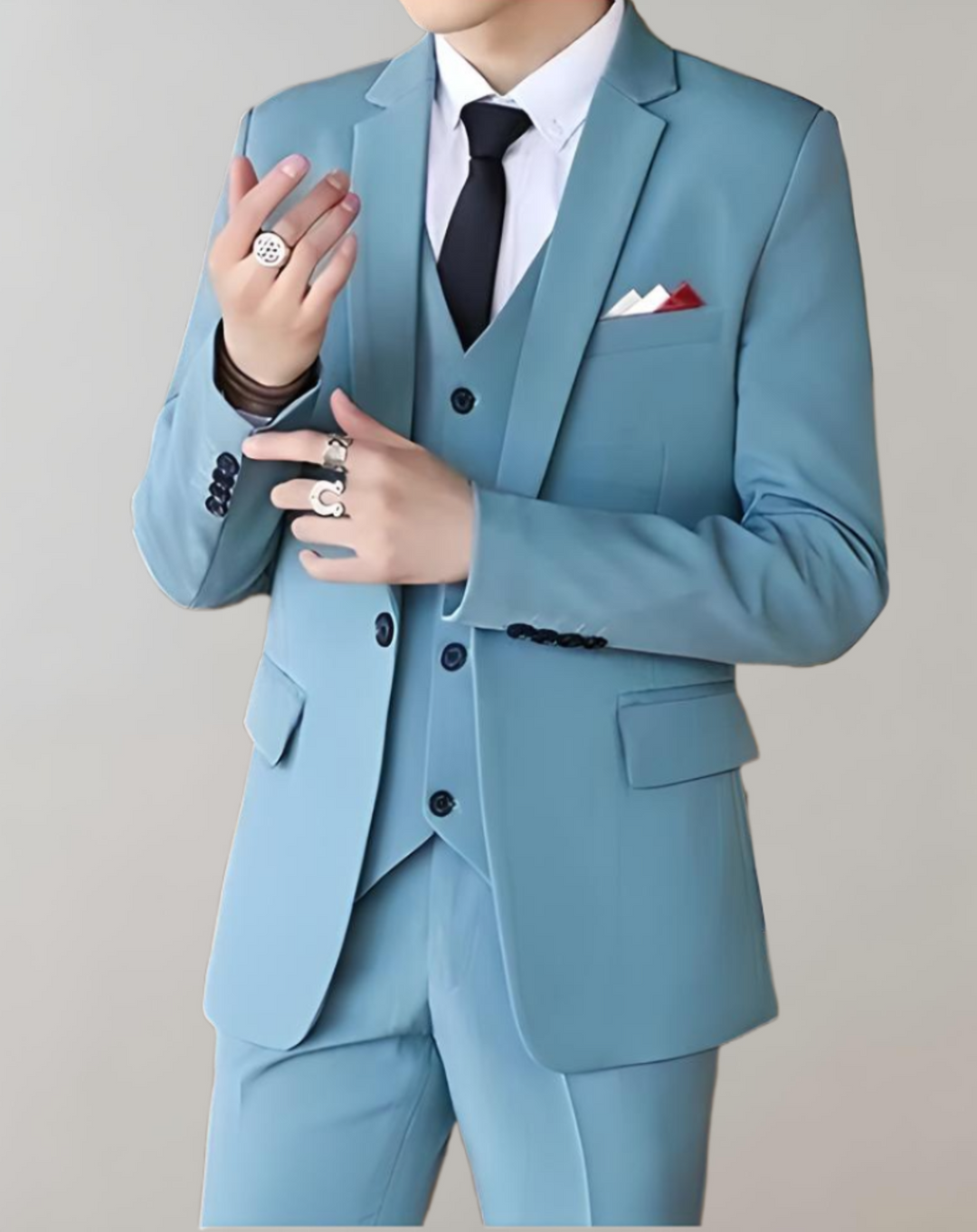 Close-up detail of lapel and button closure on men's business suit jacket
