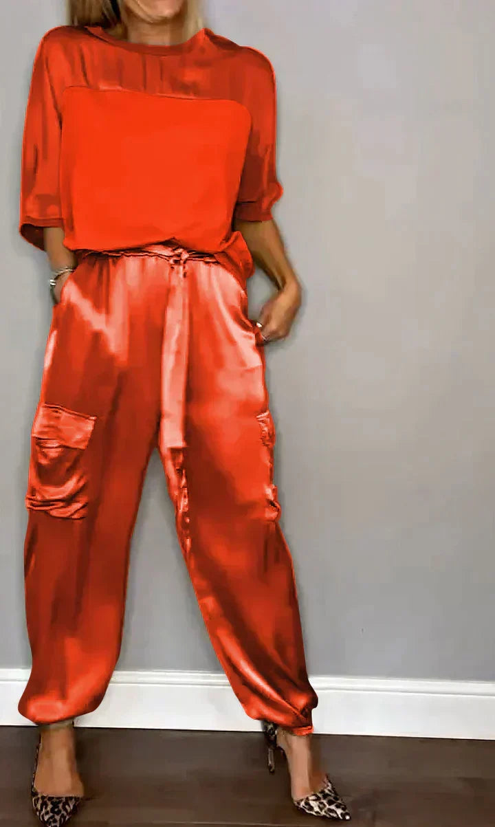 Woman wearing a red satin jumpsuit