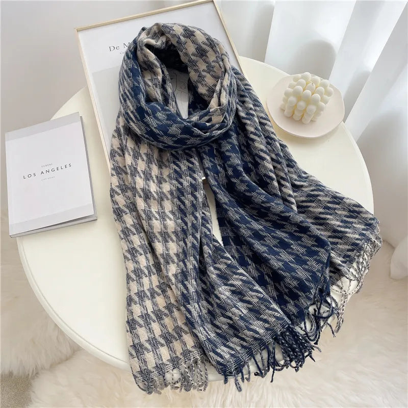 Blue and beige checked winter scarf laid out on a table