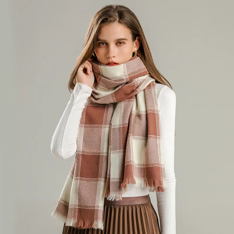 Detailed shot of the soft fabric and stitching on the women's warm checked winter scarf.