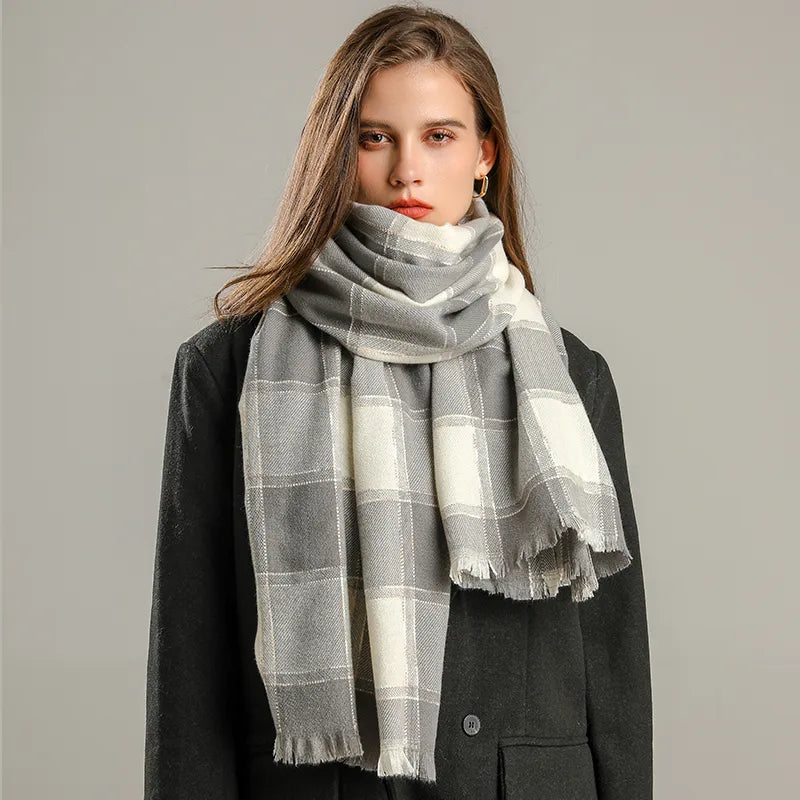 Model wearing a grey and white checked winter scarf