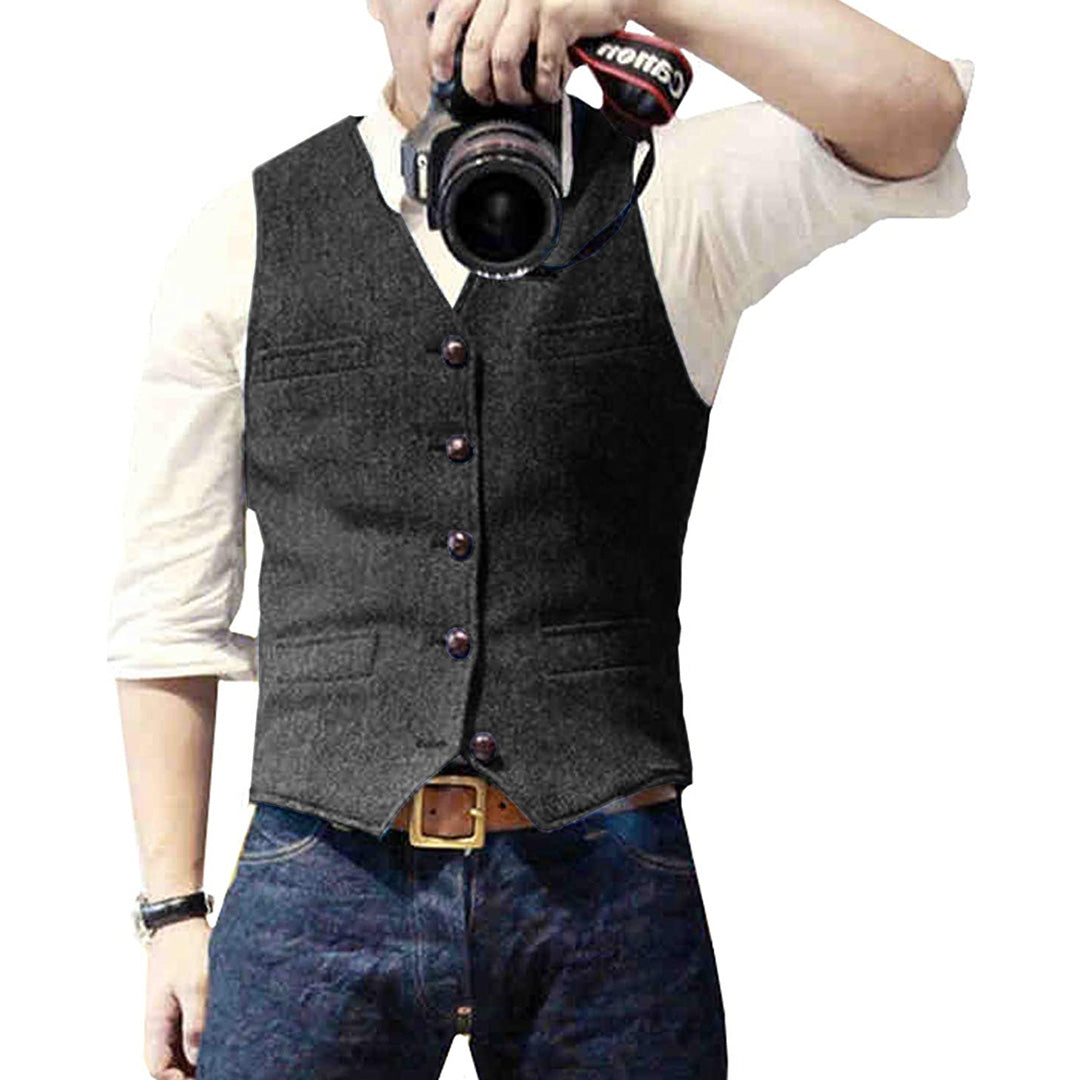 Close up of metal buttons and chest pocket on blue denim vest for men