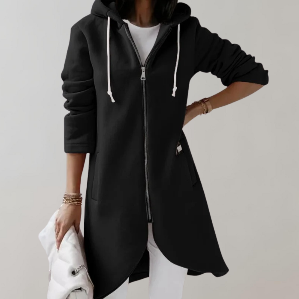 Woman wearing a black zip hooded cardigan with front pockets