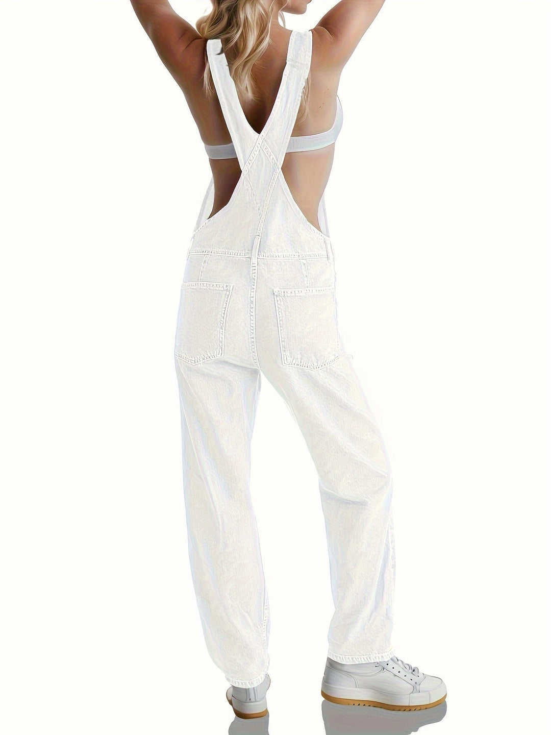 Close-up of button closure and collar on loose fit denim overall for women