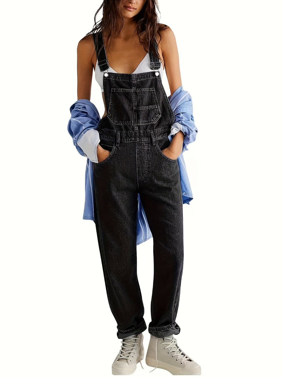 Model wearing black women's jumpsuit with casual streetwear styling