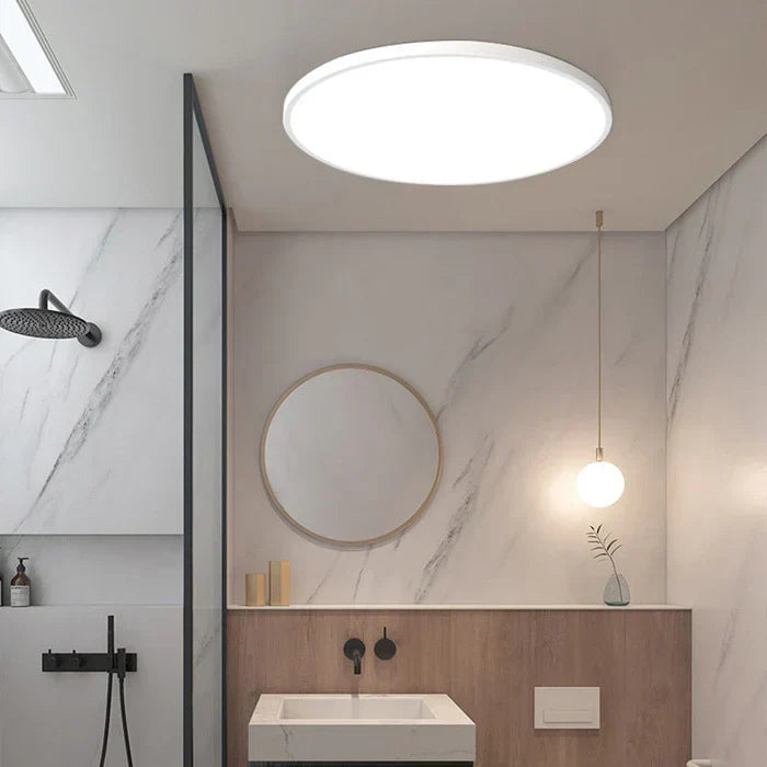OrbGlow LED ceiling light mounted in a contemporary bathroom setting