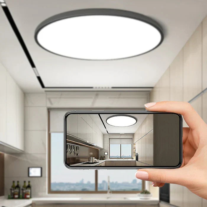 Close-up view of the energy efficient LED ceiling light showing its sleek modern design.