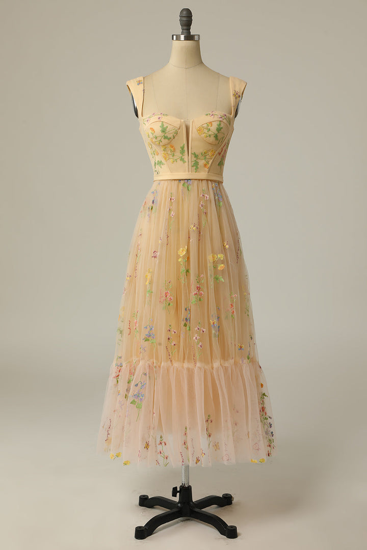 Side view of women's long embroidered A-line ball gown for formal wear