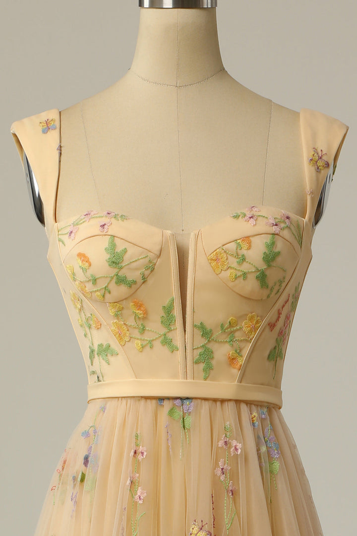 Detailed shot of the embroidered hemline on the party dress