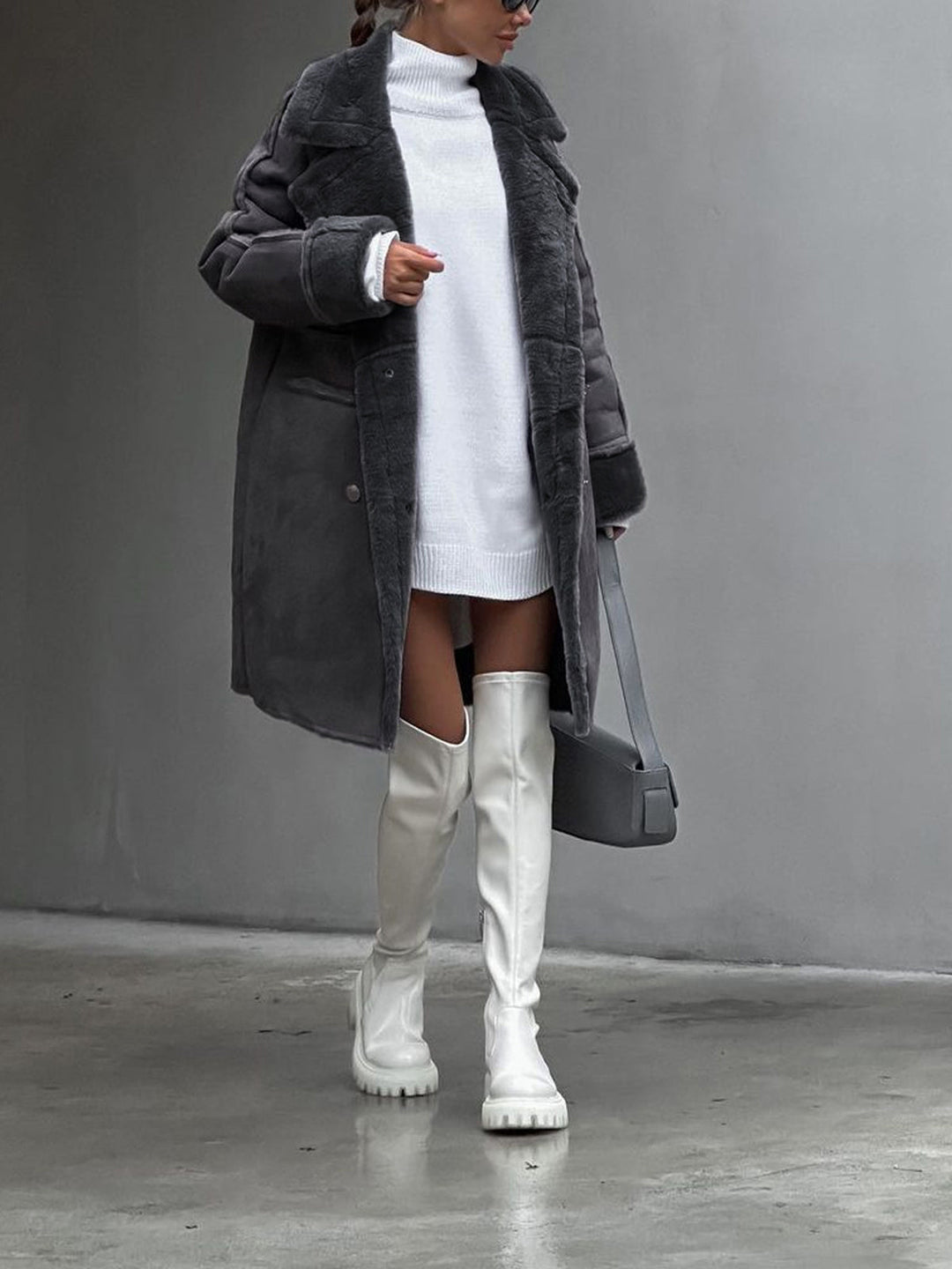Cozy grey long winter coat featuring soft fleece fabric and stylish outerwear design