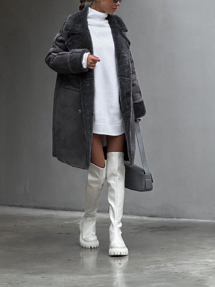 Cozy grey long winter coat featuring soft fleece fabric and stylish outerwear design