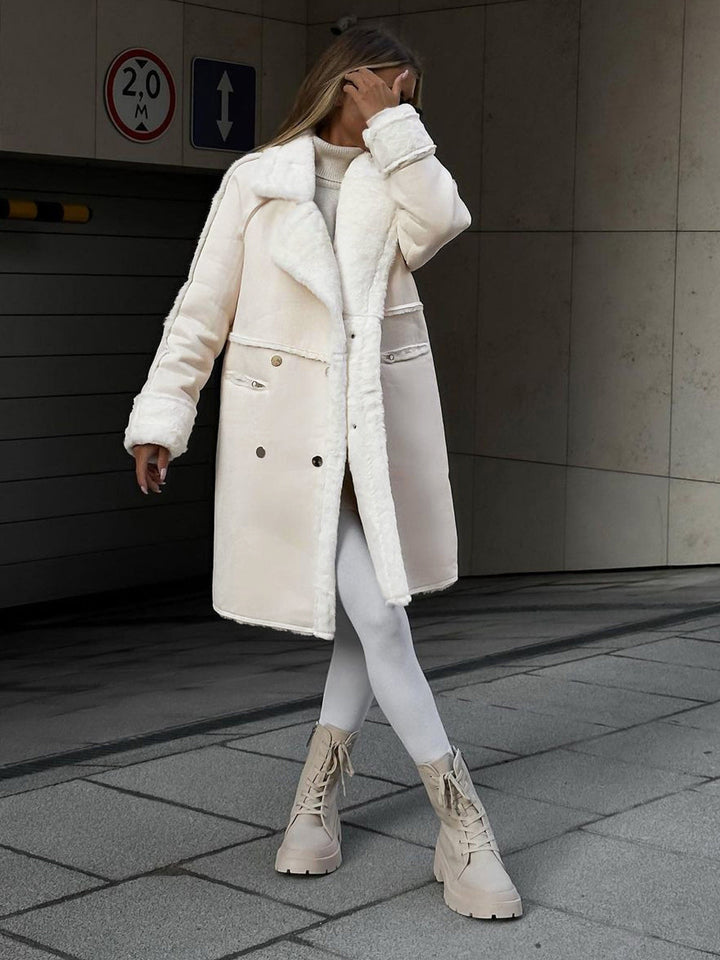 Woman wearing a stylish beige long fleece winter coat with boots