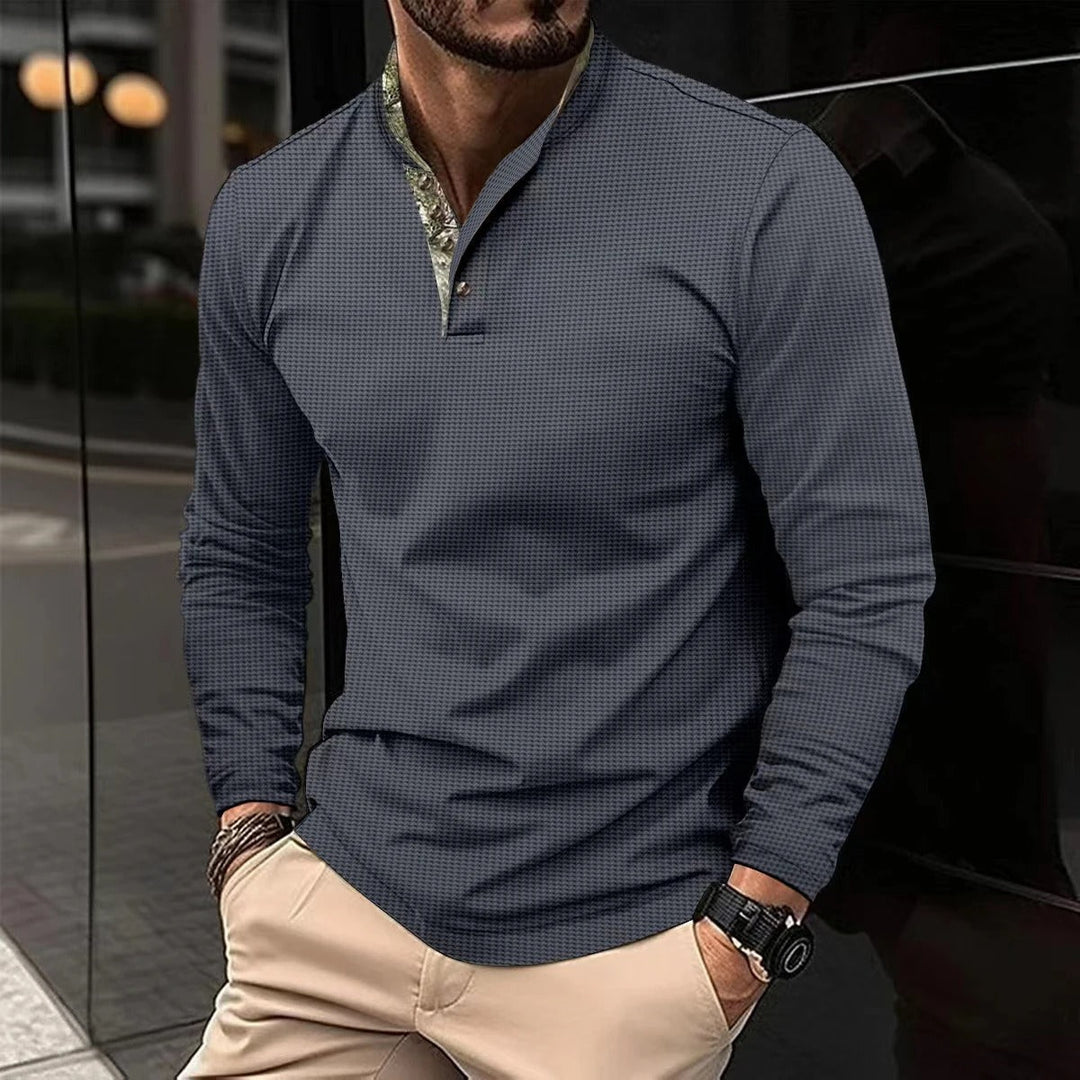 Navy blue smart casual mens long sleeve polo shirt displayed flat on a clean background