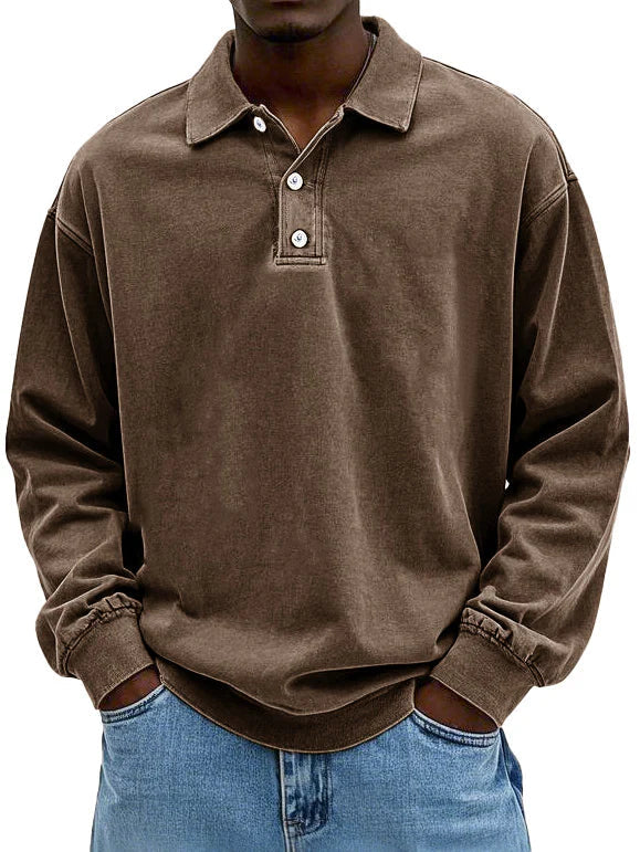 Side view of a man wearing a fitted long-sleeve polo shirt in autumn wear