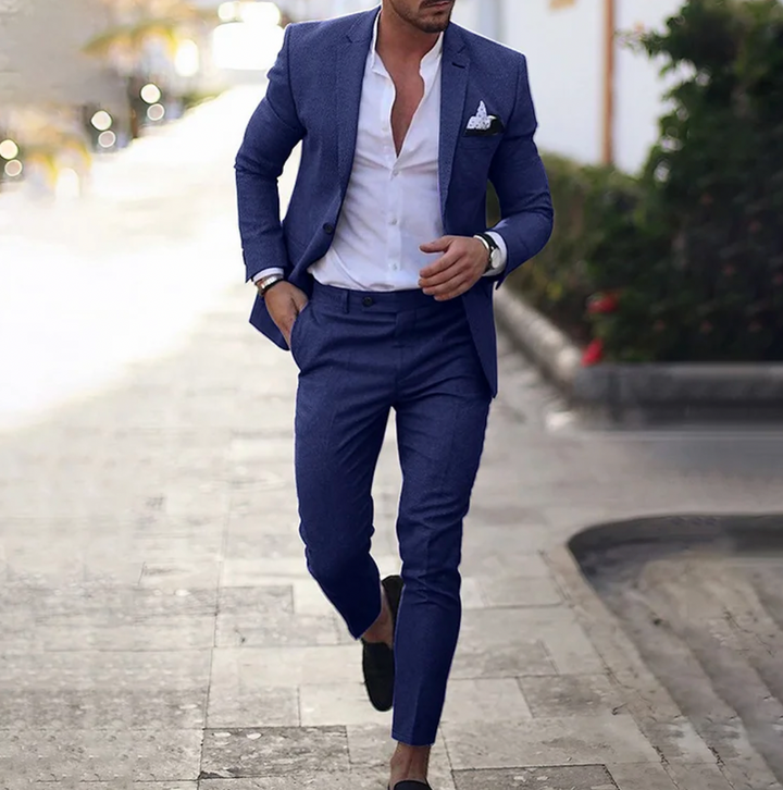 Man wearing dark blue business casual suit set with white shirt