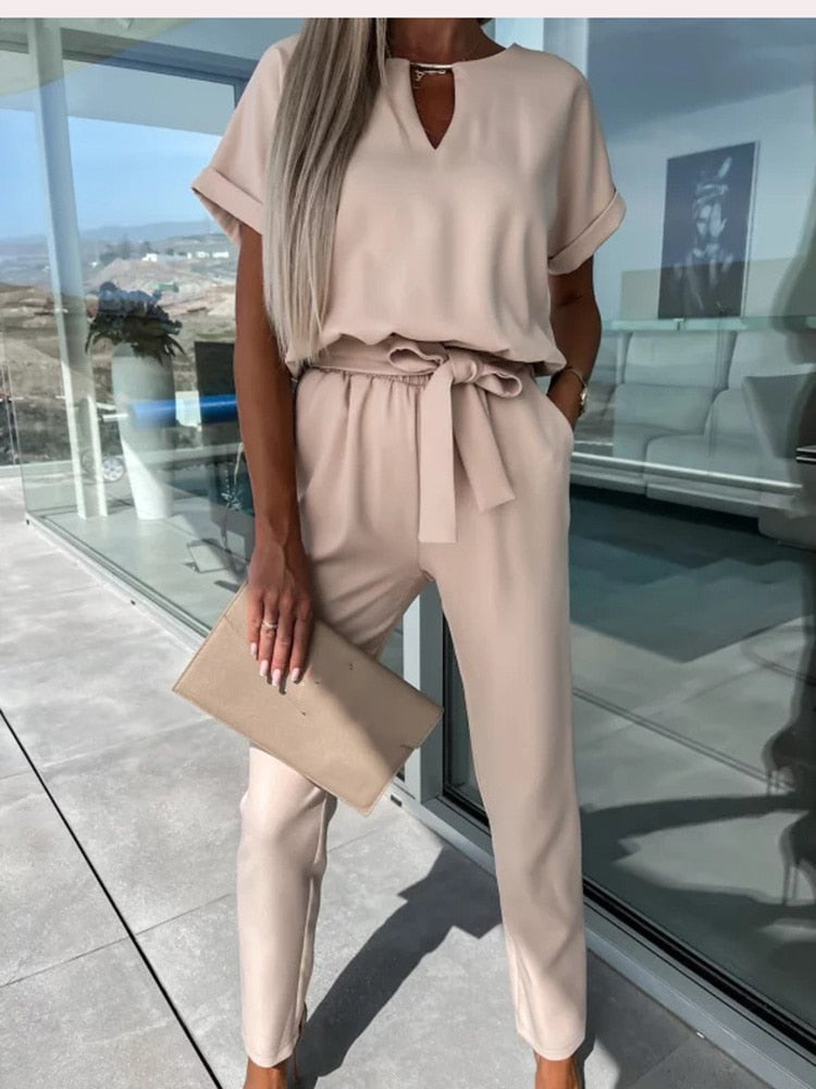 Back view of the stylish pink V-neck jumpsuit with a secure zipper closure