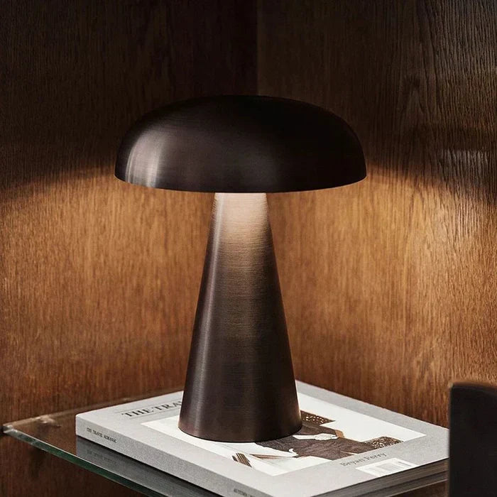 Stylish portable mushroom lamp placed on a wooden office desk