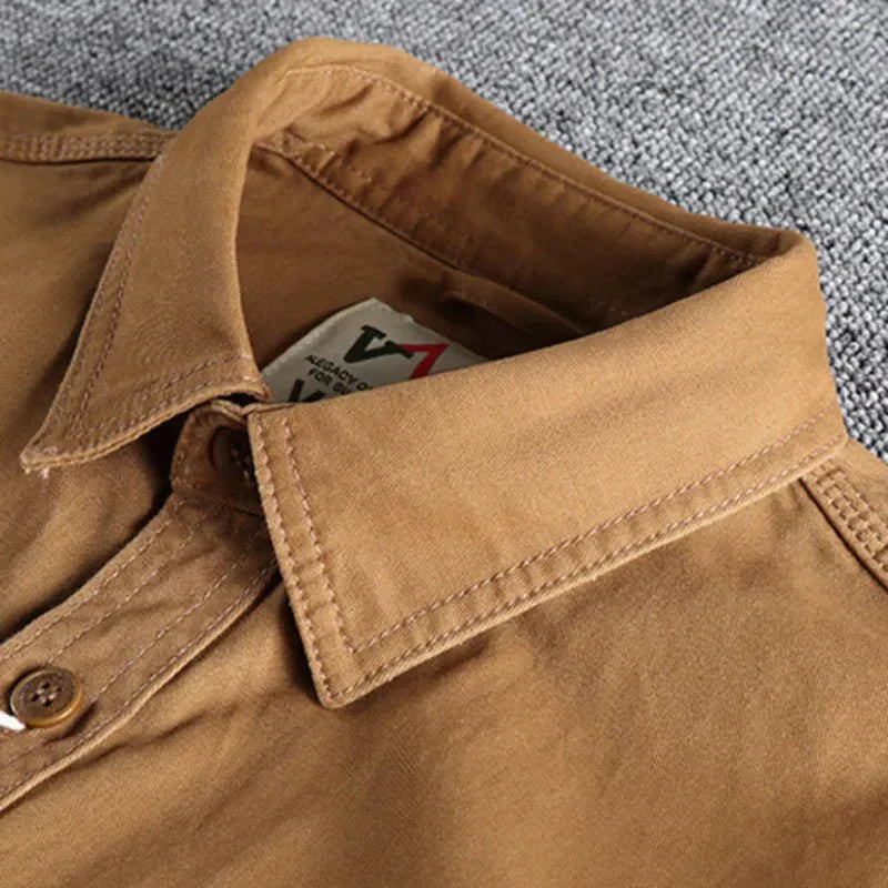 Military green men's utility shirt with button-down design and long sleeves
