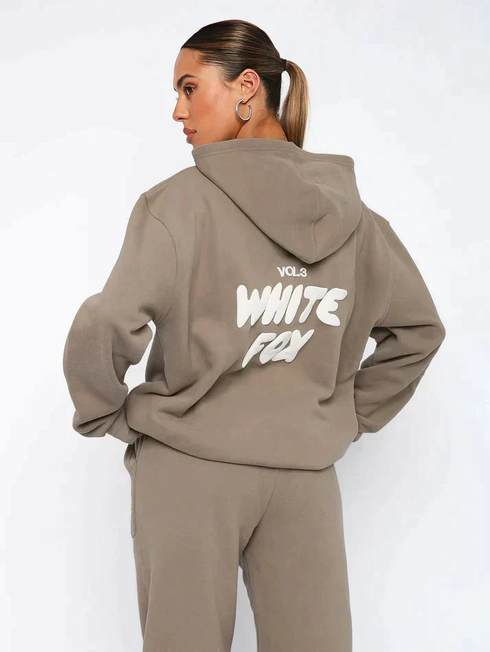 Womens oversized hooded tracksuit top with cozy front pocket and relaxed streetwear fit