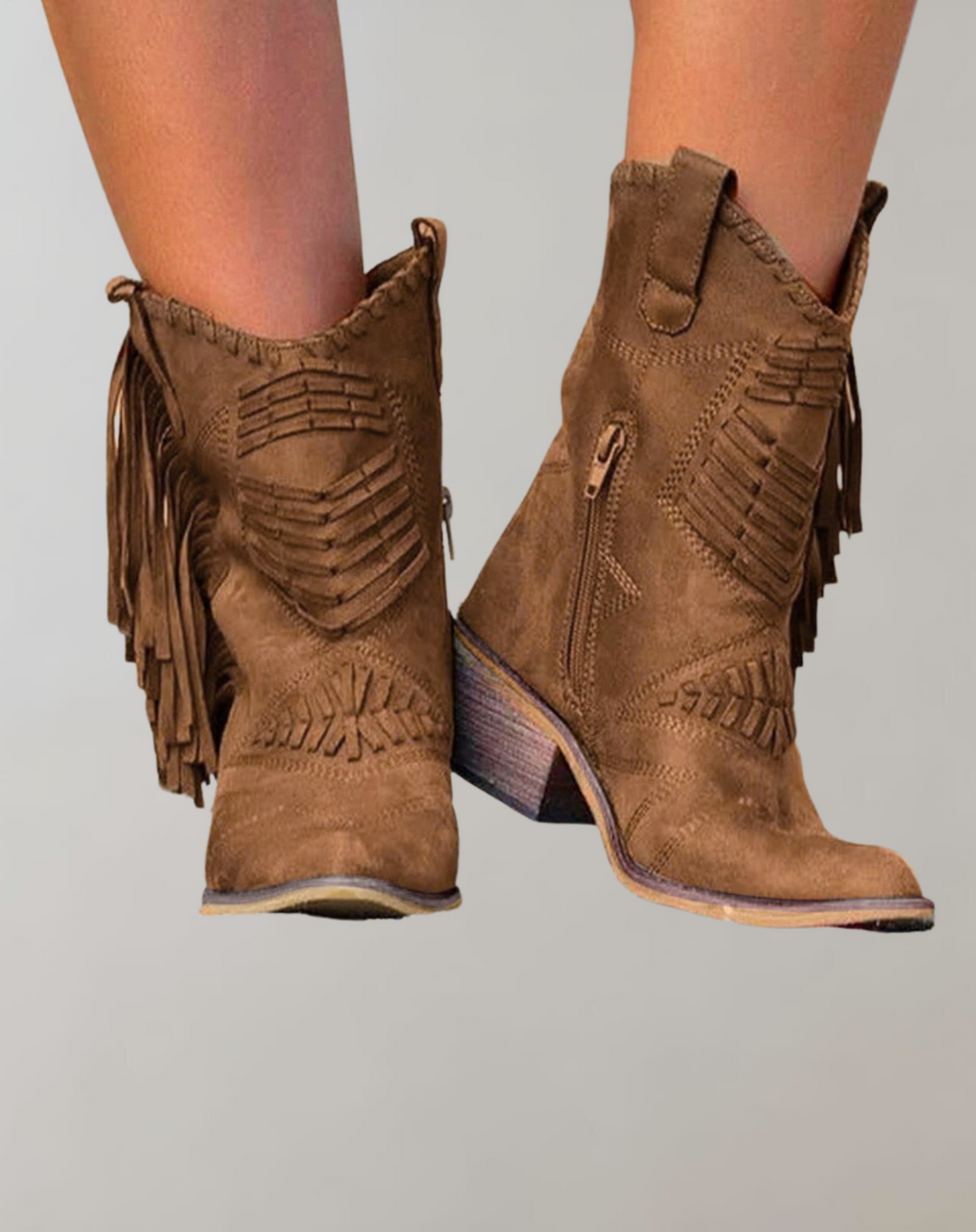 Brown women's tassel ankle boots showcasing side zipper and heel